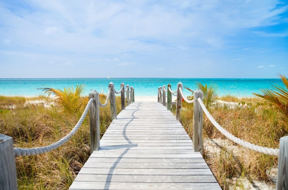 Vacation Travel Innovation Reviews features the bright Caribbean coastline and clear water associated with Turks and Caicos travel.